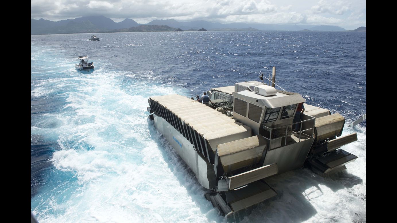 A half-scale <a href="http://www.cnn.com/2014/07/16/tech/innovation/marines-amphibious-vehicle/index.html" target="_blank">Ultra Heavy-lift Amphibious Connector prototype</a>, created by Navatek Ltd. and the Office of Naval Research, departs the amphibious dock landing ship USS Rushmore on July 11. The UHAC was unveiled during RIMPAC exercises.