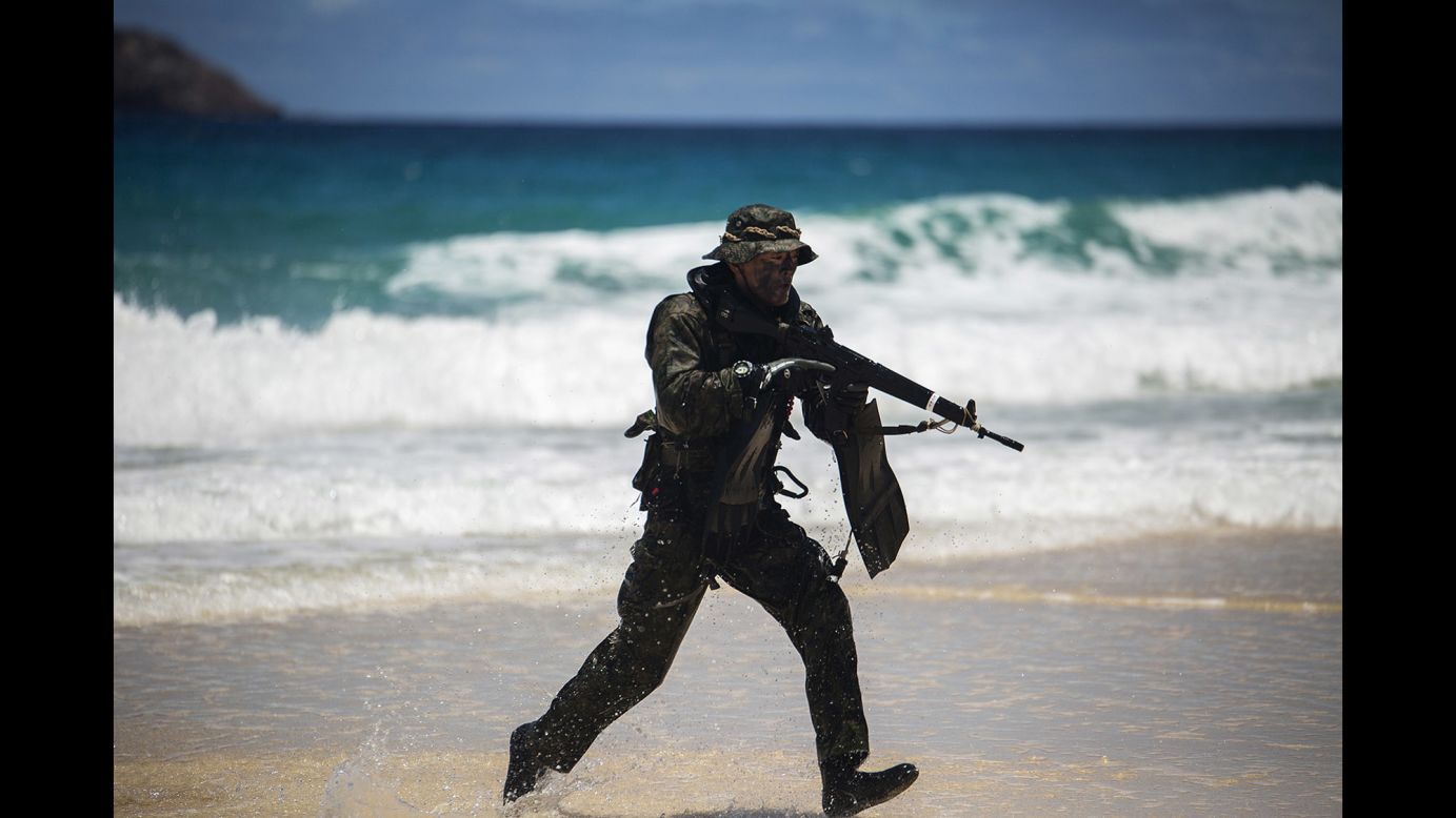 A Japanese soldier sprints to take a position on Pyramid Rock Beach during the July 1 training exercise.
