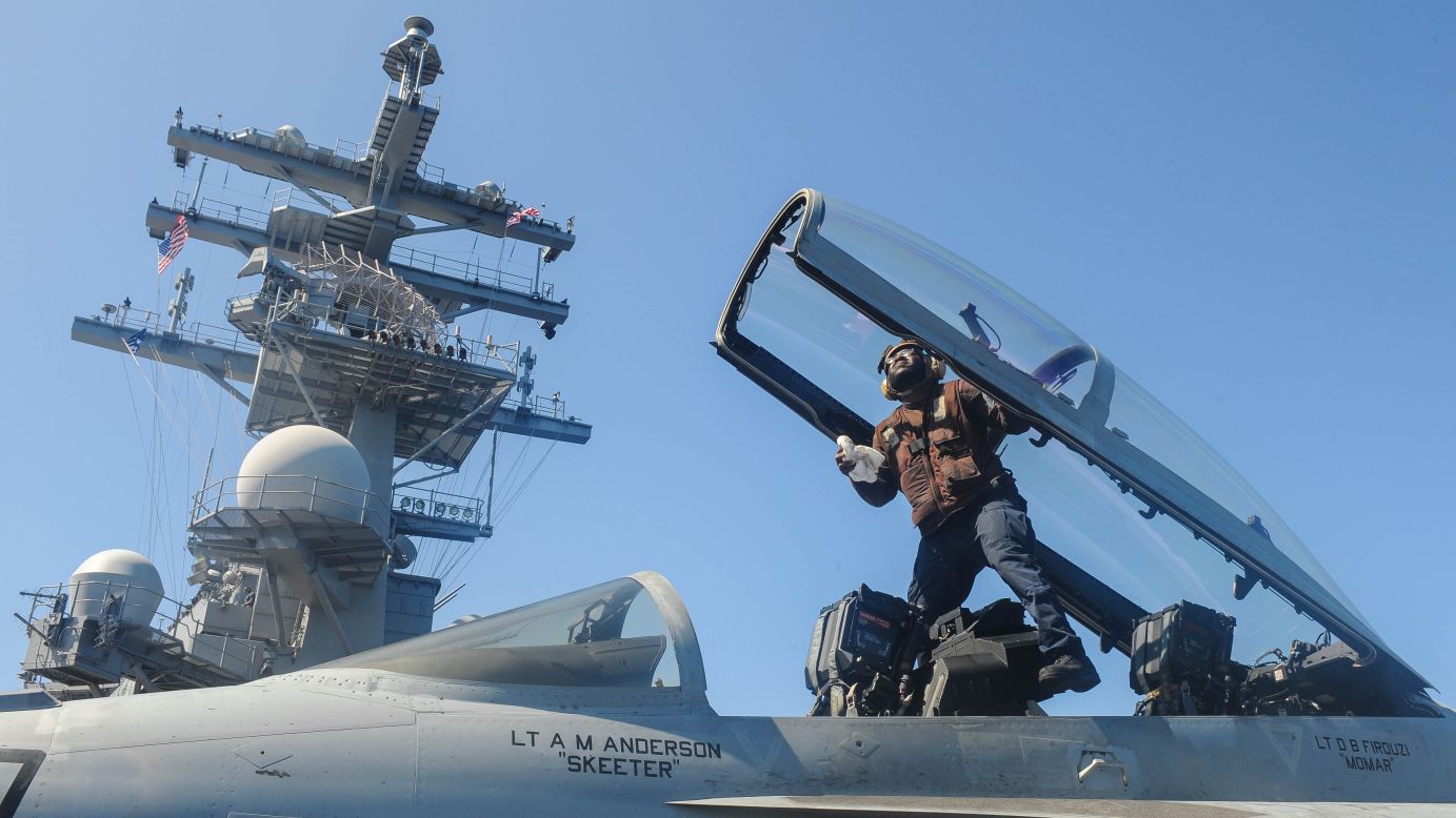 Airman Antony Hopson cleans the cockpit of an F/A-18 Super Hornet aboard the USS Ronald Reagan on July 26.