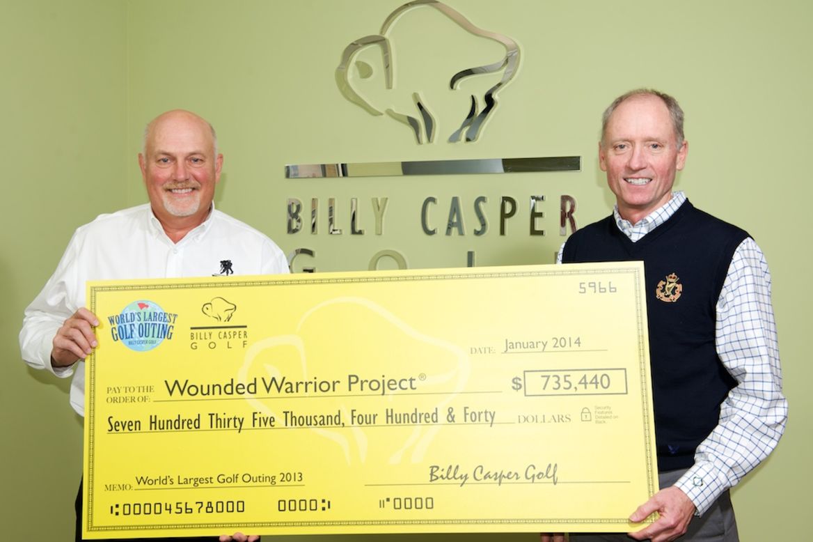 Peter Hill, CEO of Billy Casper Golf, presents a check to the Wounded Warrior Project for funds raised by the WLGO, which this year takes place at over 150 U.S. courses. 