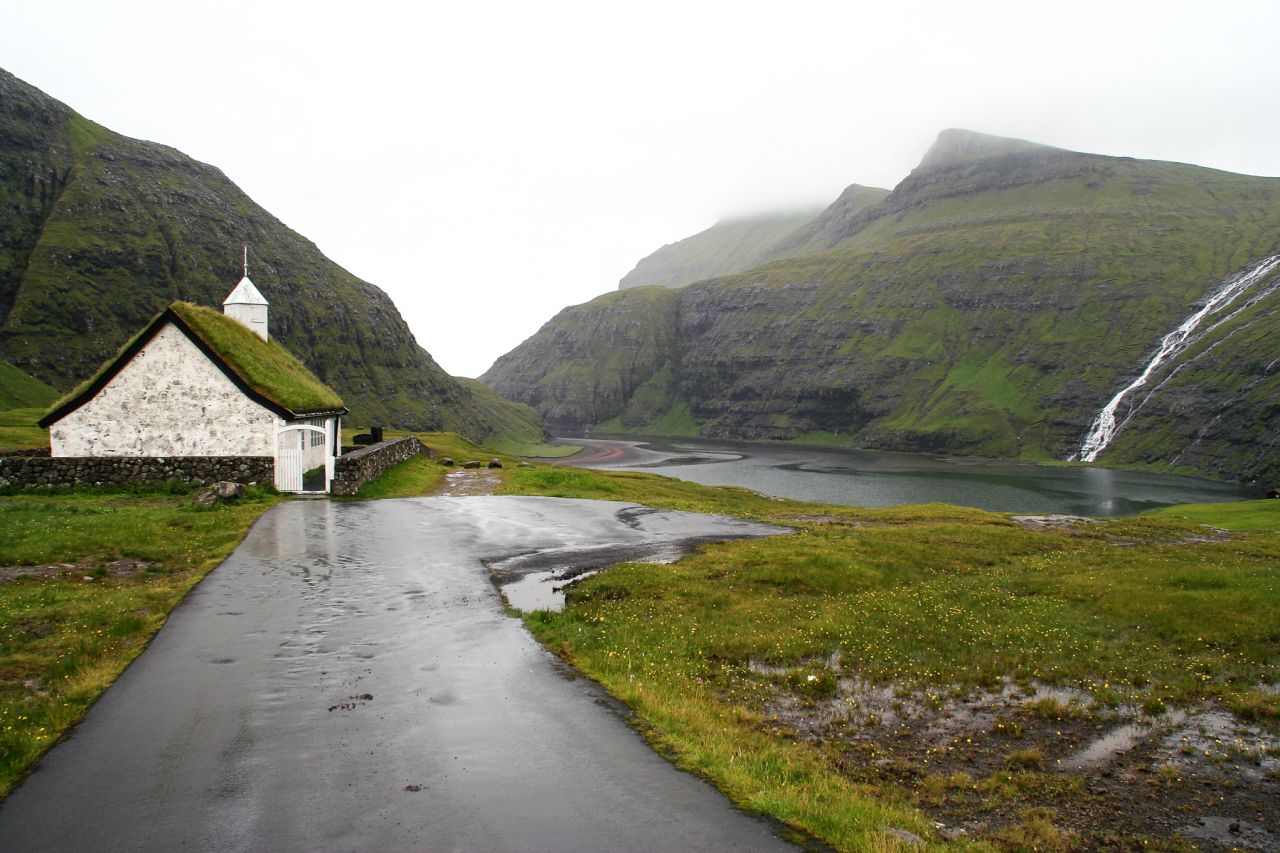 One of the most picturesque churches in the Faroes is in Saksun. Surrounded by waterfalls and overlooking a narrow fjord, this church was built in 1858 with, naturally, a roof made of the surrounding turf. 