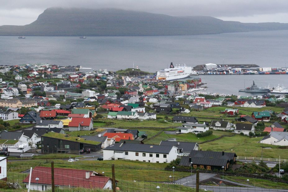 In Torshavn harbor, a Smyril Line ship has just arrived from Denmark, bringing tourists for a three-day stopover on their way to Iceland.