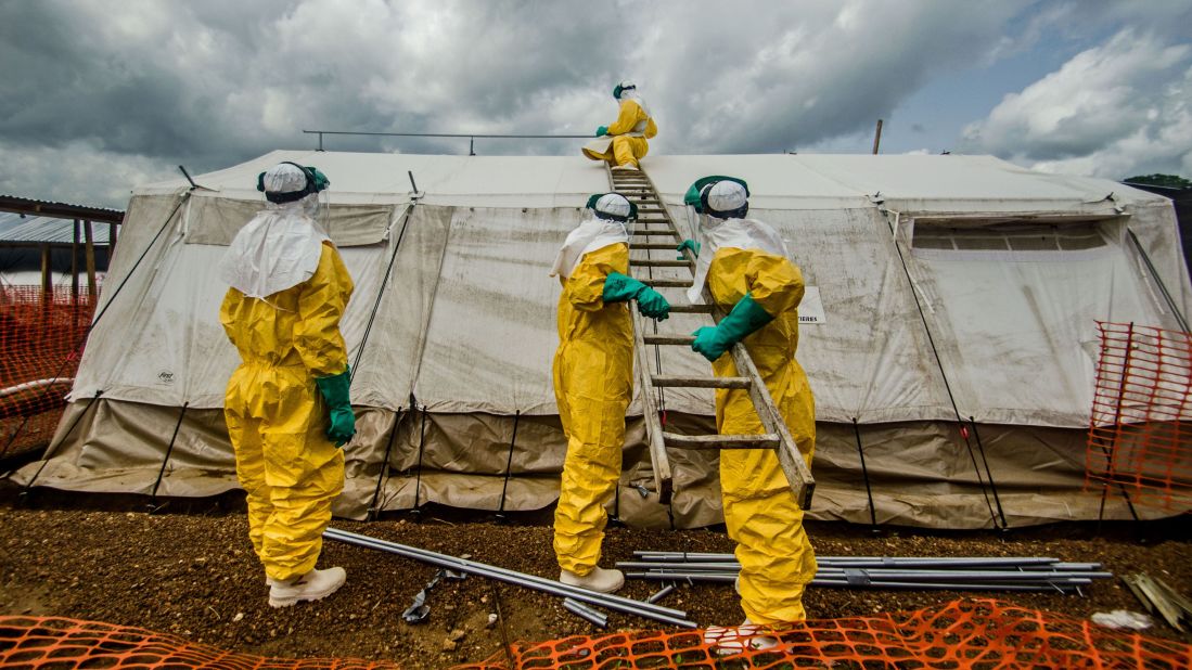 Members of Doctors Without Borders adjust tents in the isolation area in Kailahun on July 20, 2014.