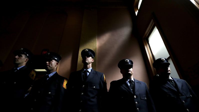 Cadets attend a swearing-in ceremony in Jersey City, New Jersey, on Friday, July 25. The cadets were sworn in as Jersey City Fire Department firefighters.