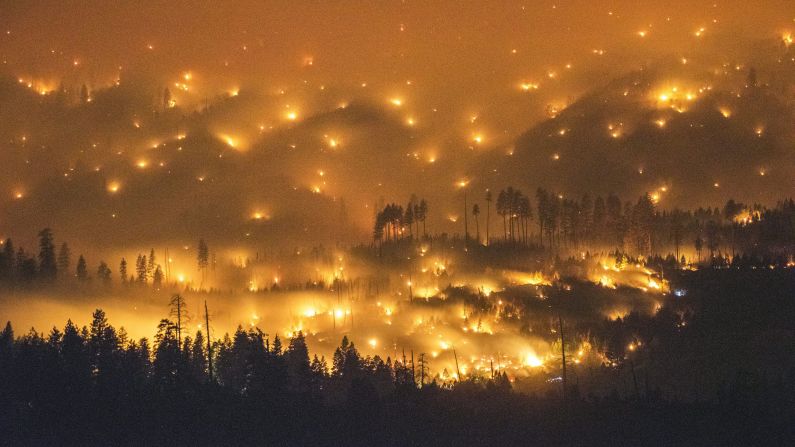 A long exposure image shows the El Portal Fire burning near Yosemite National Park, California, on Sunday, July 27.