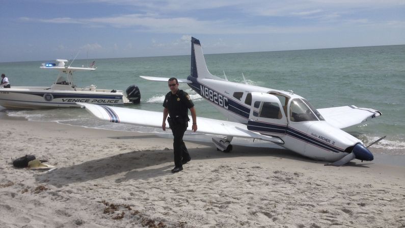 First responders work the scene of a <a href="http://www.cnn.com/2014/07/29/us/florida-plane-accident/index.html">single engine Piper Cherokee plane crash</a> at Caspersen Beach in Venice, Florida, on Sunday, July 27. A 9-year-old girl and her father were struck by the plane walking along a Florida beach. The father died at the scene, and the girl succumbed to her injuries on Tuesday, July 29. 