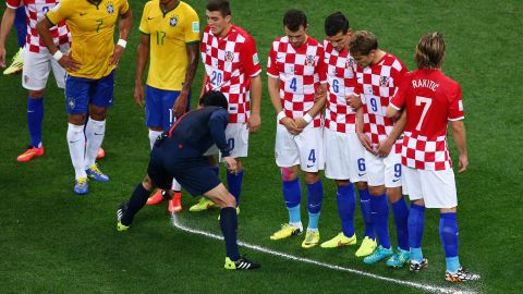 A referee uses the vanishing spray in the opening match of the World Cup between Brazil and Croatia. 