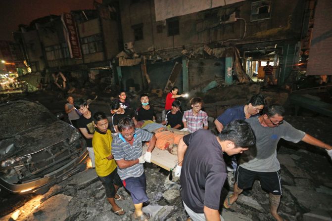 The body of a victim killed in a <a href="http://www.cnn.com/2014/07/31/world/asia/taiwan-explosions/index.html" target="_blank">gas explosion from an underground gas leak in Kaohsiung, Taiwan,</a> is carried from the rubble on Friday, August 1. The explosion killed several people and injured hundreds more.  