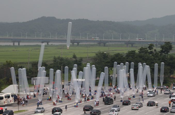 Activists release giant balloons carrying chocolate snacks, known as Choco Pies, for North Korea at the border village of Panmunjom, in South Korea.
