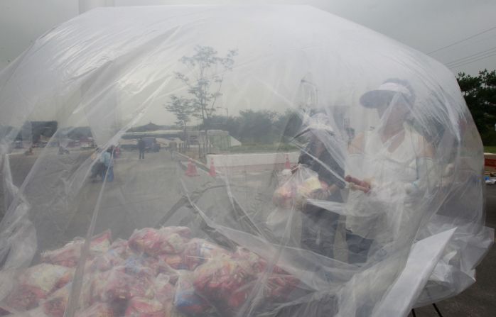 Volunteers comprised of former North Koreans and South Korean activists prepare plastic bags of the snacks on Wednesday.