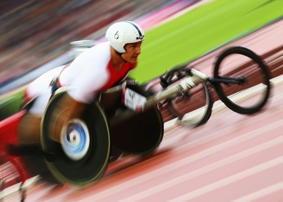 AUGUST 1 - GLASGOW, SCOTLAND: David Weir of England competes in the Glasgow 2014 Commonwealth Games. Unlike the Olympics and Paralympics, at the Commonwealth Games events for disabled athletes take place at the same time as the able-bodied competitions.