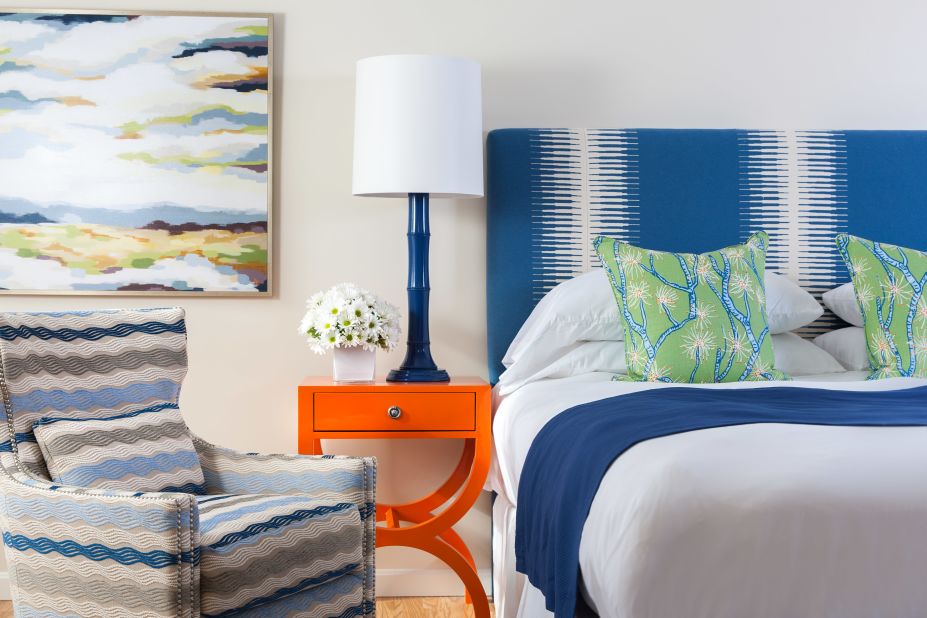 At The Break in Narragansett, Rhode Island, colorful hues highlight each of the 16 rooms, including coral-motif pillows and nightstands the color of tangerines that exude a mid-century vibe. 