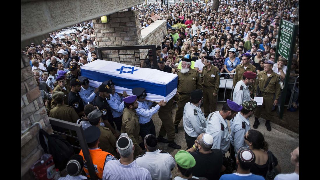 An honor guard caries the coffin of Israeli Lt. Hadar Goldin during his funeral in Kfar-saba, Israel, on August 3. Goldin was thought to have been captured during fighting in Gaza but was later declared killed in action by the Israel Defense Forces.