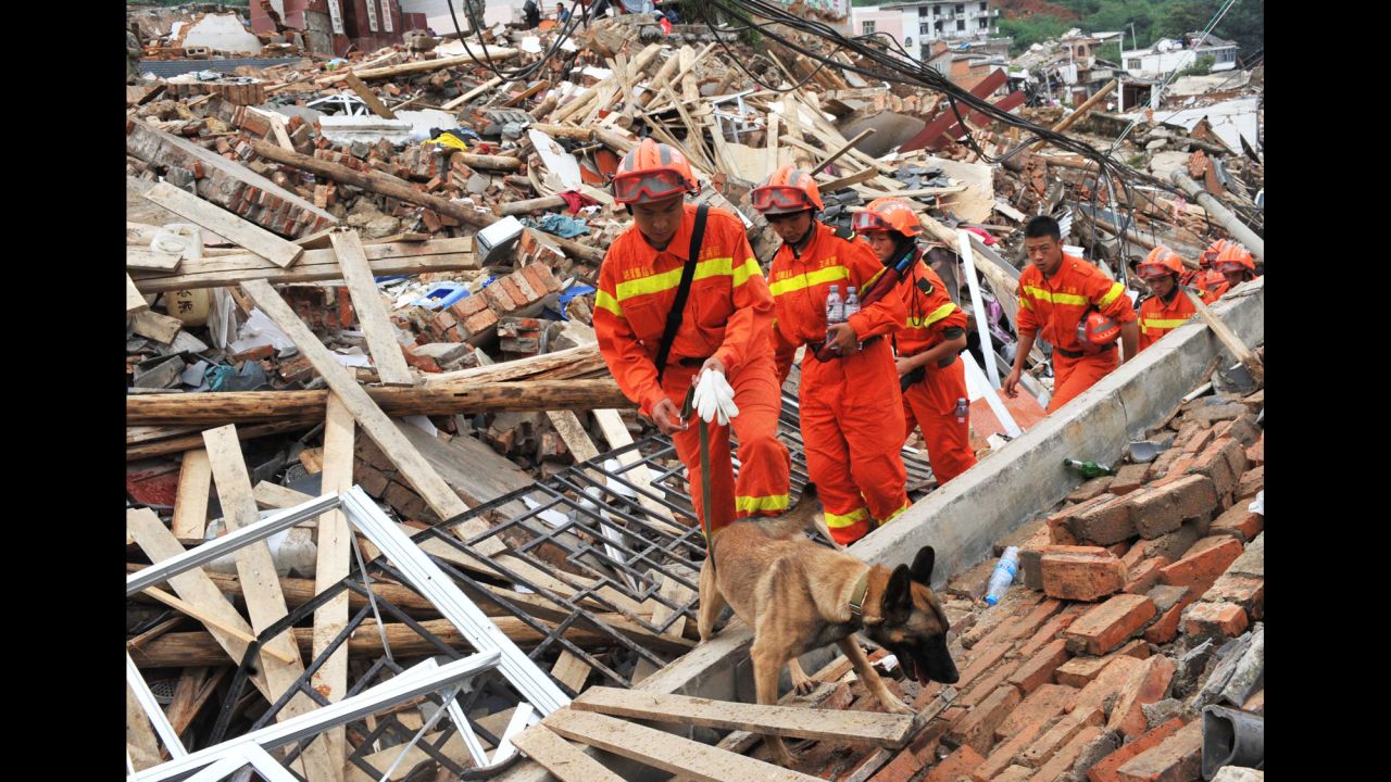 Rescuers search for survivors August 4 in the ruins of Longtoushan. Hundreds of aftershocks have been recorded since the first tremor.