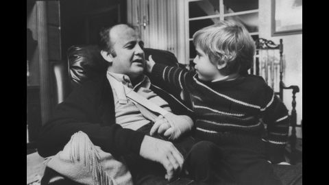 Brady, with his left hand in a sling, chats with his son, Scott, in November 1981. Because of the shooting, Brady had to use a wheelchair for the rest of his life.