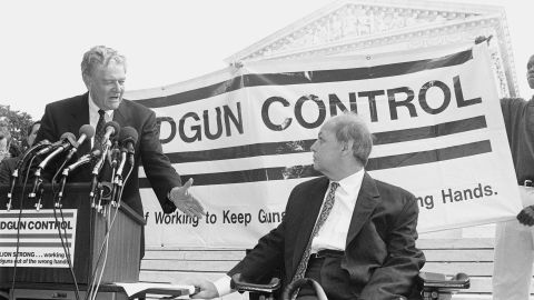 Maryland Attorney General Joseph Curran reaches to shake Brady's hand outside the U.S. Supreme Court in October 1981. After leaving the White House, Brady launched the Brady Campaign to Prevent Gun Violence, which pushes for stricter firearms laws.