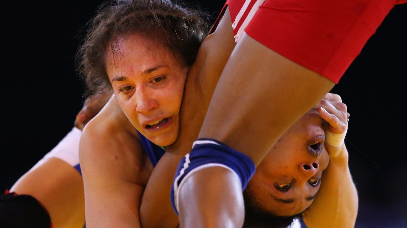 Canada's Brittanee Laverdure, left, and Nigeria's Ifeoma Nwoye wrestle Thursday, July 31, in the semifinals of the 55-kilogram (121-pound) weight class at the Commonwealth Games in Glasgow, Scotland. Laverdure won the match and the final as well to take the gold medal.