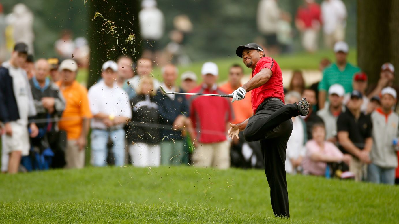 Tiger Woods hits out of the rough during the final round of the WGC-Bridgestone Invitational, which was played Sunday, August 3, in Akron, Ohio. Woods <a href="http://www.cnn.com/2014/08/03/sport/golf/golf-woods-new-injury-blow/index.html">reinjured his lower back</a> during the round, forcing him to pull out of the tournament. Woods had just recently returned to competitive action after taking three months off to have surgery.