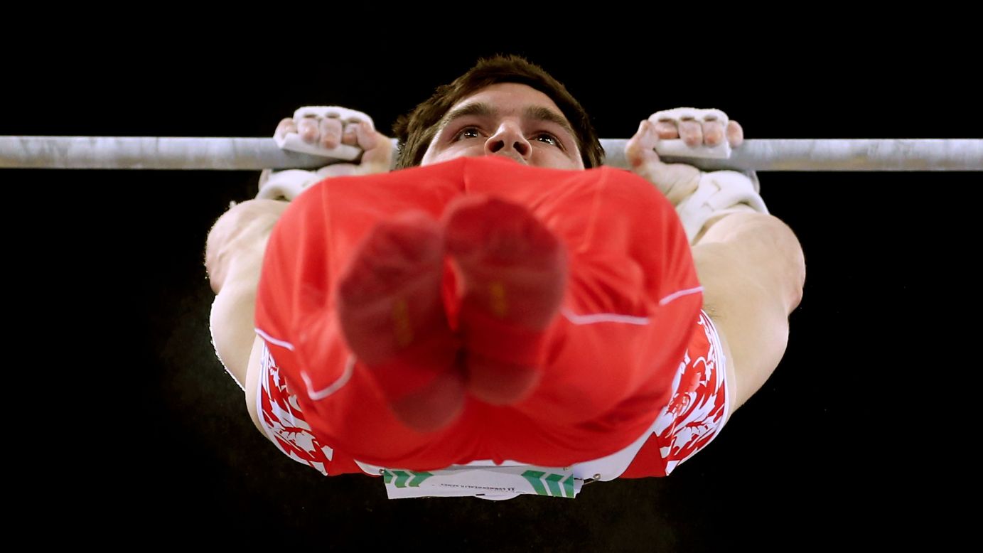 Kevin Lytwyn of Canada competes in the final of the horizontal bar, or high bar, during the Commonwealth Games in Glasgow, Scotland, on Friday, August 1. He won the bronze medal in the event. England's Nile Wilson won gold.
