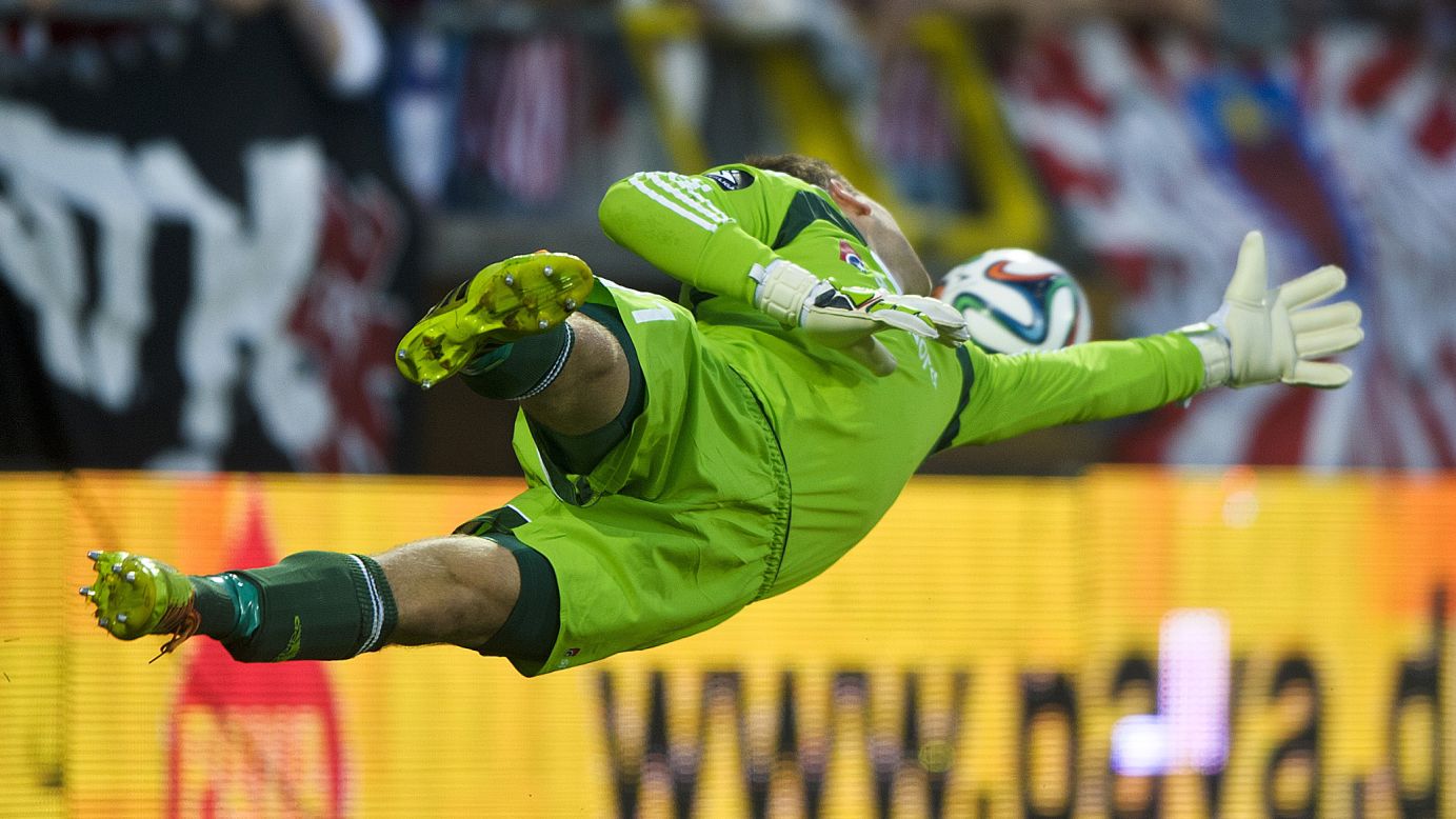 Nicolai Larsen, a goalkeeper for Danish soccer club Aalborg, reaches for a shot Wednesday, July 30, during a UEFA Champions League qualifying match against Croatian club Dinamo Zagreb in Aalborg, Denmark. Dinamo won the match 1-0 off this shot from Marcelo Brozovic.