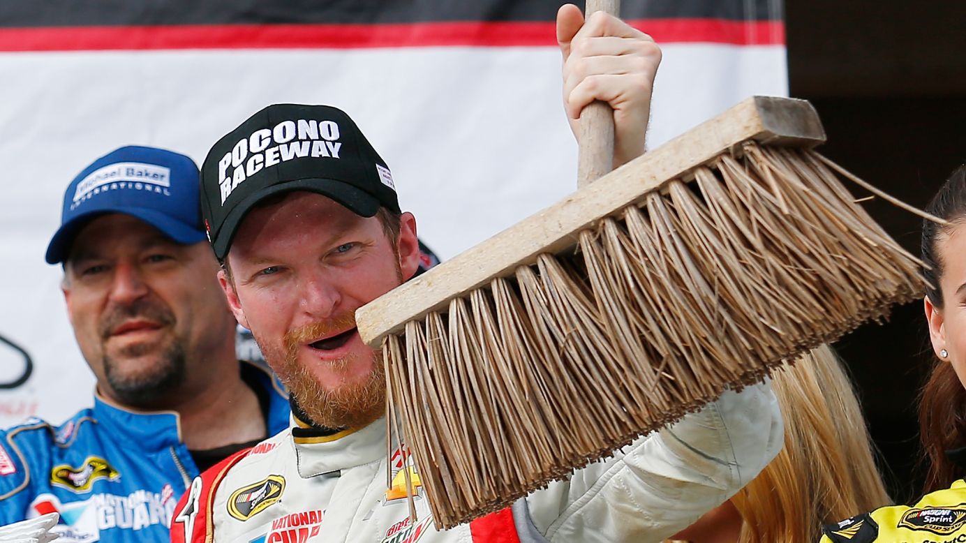 NASCAR driver Dale Earnhardt Jr. holds up a broom Sunday, August 3, after winning the Sprint Cup race at Pocono Raceway in Long Pond, Pennsylvania. Earnhardt also won the June race at Pocono, completing the season "sweep" at the track.