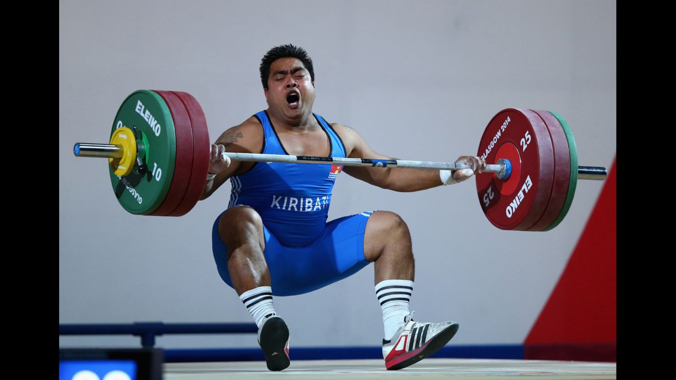 David Katoatau of Kiribati drops the bar during a weightlifting event Wednesday, July 30, at the Commonwealth Games in Glasgow, Scotland. He won gold in his 105-kilogram (231-pound) weight class.