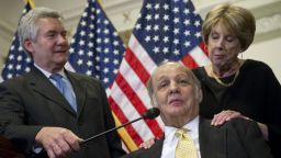 Former White House Press Secretary Jim Brady (C) speaks alongside his wife, Sarah (R), and Brady Campaign President Paul Helmke (L), about new legislation curbing gun violence during a press conference on Capitol Hill in Washington, DC, March 30, 2011. Brady was shot by John Hinkley, Jr, during his attempt to assassinate former US President Ronald Reagan on March 30, 1981. AFP PHOTO / Saul LOEB (Photo credit should read SAUL LOEB/AFP/Getty Images)