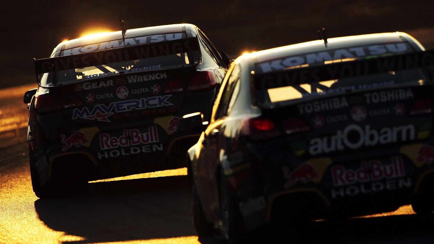 Jamie Whincup leads Craig Lowndes in a race at the Ipswich 400, held Saturday, August 2, at Queensland Raceway in Ipswich, Australia. Whincup won two of the three races at Queensland to move atop the standings of the V8 Supercar Championship Series.