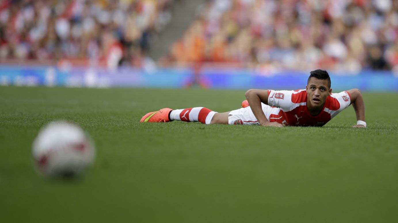 Arsenal's Alexis Sanchez watches the ball during a preseason match played Saturday, August 2, against Portuguese club Benfica in London. It was Sanchez's first match with his new club since his transfer from Spanish club Barcelona.