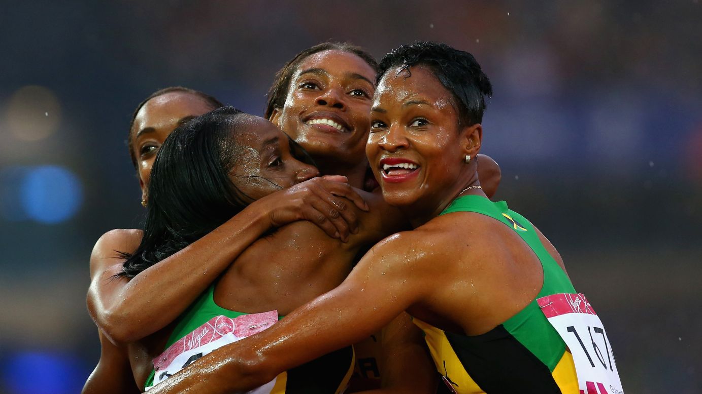 Jamaican sprinters Christine Day, Novlene Williams-Mills, Anastasia Le-Roy and Stephenie McPherson embrace after winning gold in the 4x100-meter relay Saturday, August 2, at the Commonwealth Games in Glasgow, Scotland.