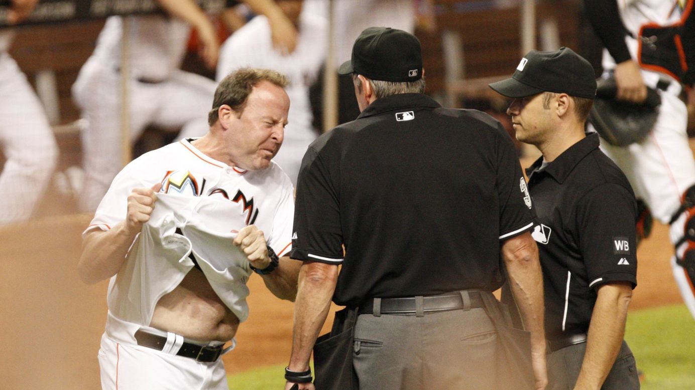 Miami Marlins manager Mike Redmond reacts furiously after a call at home plate Thursday, July 31, during a game against the Cincinnati Reds in Miami. Redmond was ejected from the game for his eighth-inning outburst, and the Reds won 3-1.