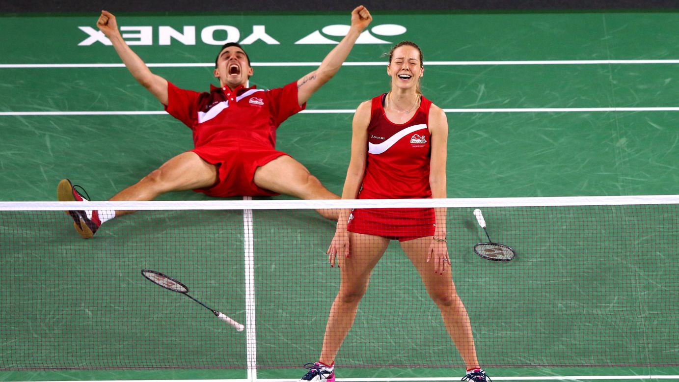 English badminton players Gabrielle and Chris Adcock celebrate Sunday, August 3, after winning the gold medal in mixed doubles at the Commonwealth Games in Glasgow, Scotland.