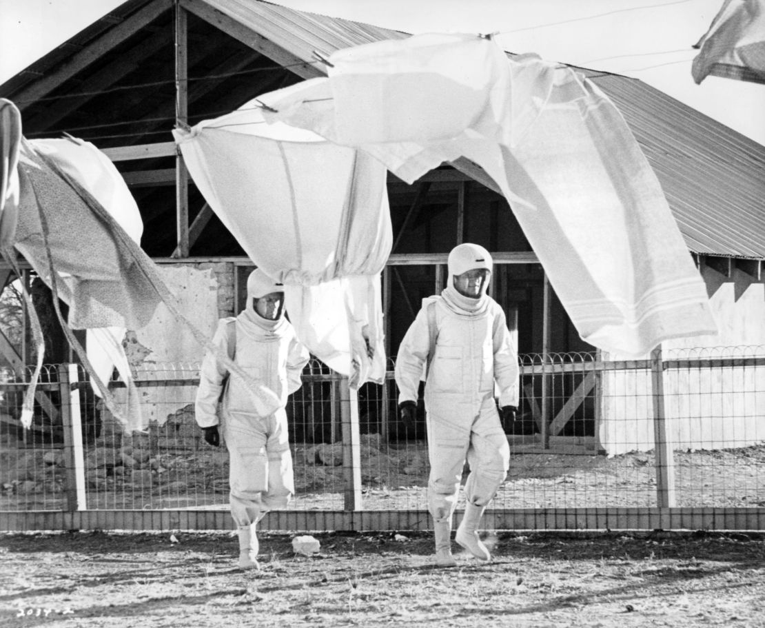 James Olson, left, and Arthur Hill walk in protective suits in a scene from the 1971 film, "The Andromeda Strain."