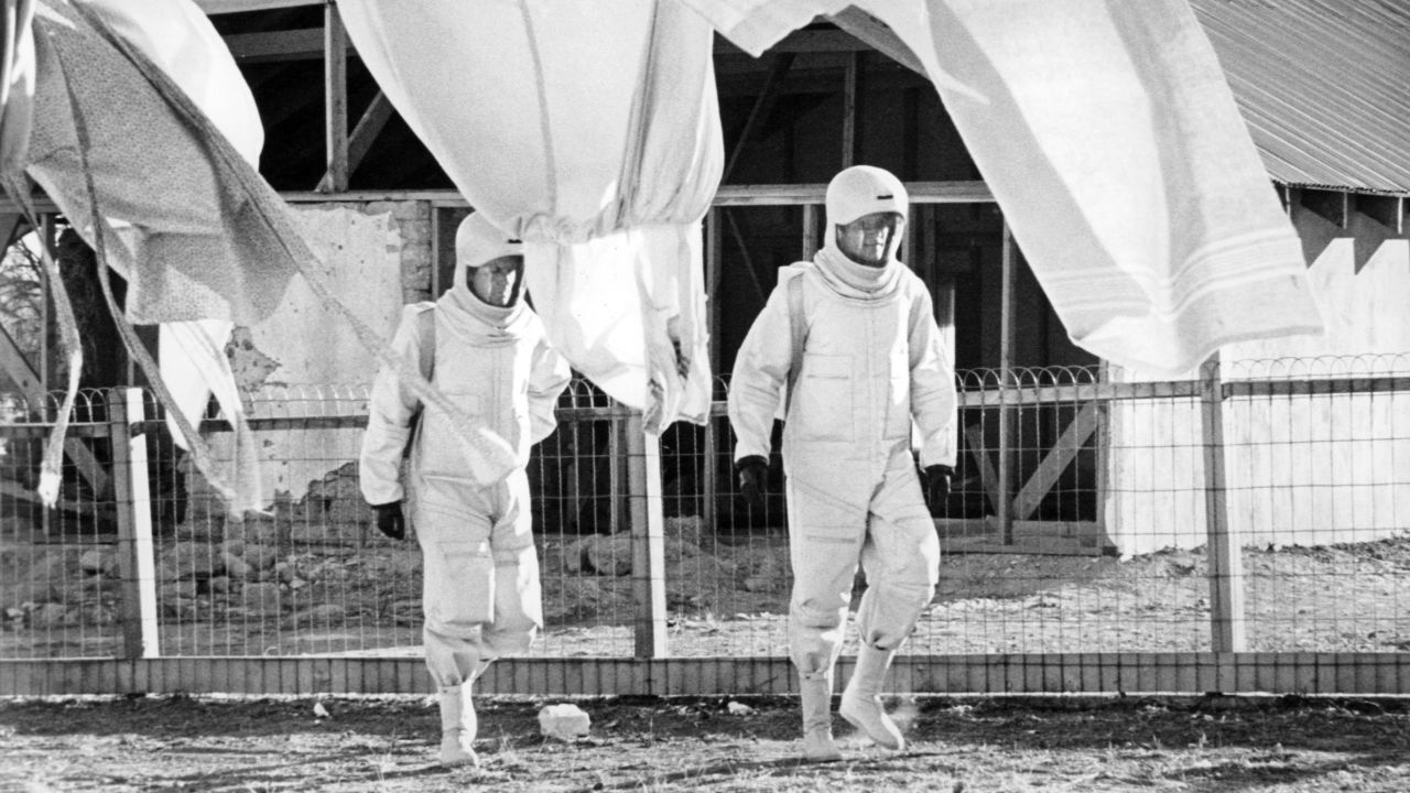 James Olson, left, and Arthur Hill walk in protective suits in a scene from the 1971 film, "The Andromeda Strain."
