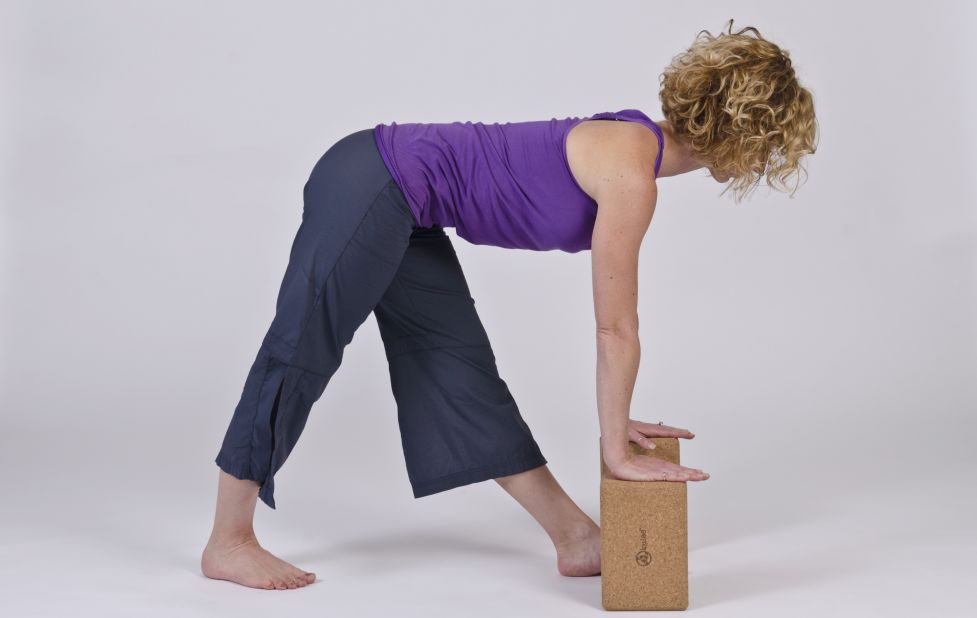 This pose is a combination of hamstring stretching and pelvis resetting. Some people swear by hamstring stretches, while others find it aggravates the nerve. Try it carefully. Back off if pain increases.