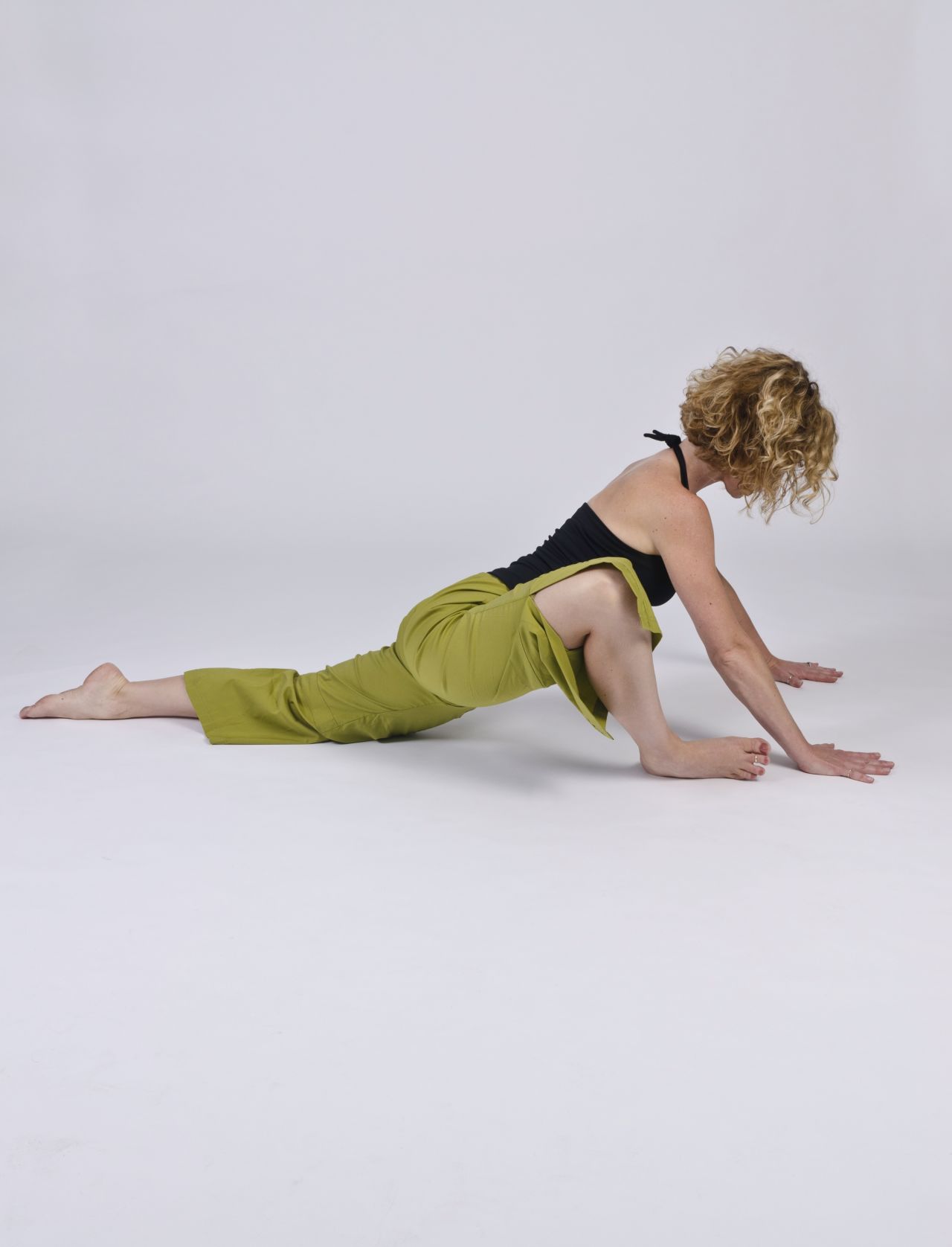 This is a piriformis-stretching pose for the front leg and a hip-flexor stretch for the back leg.