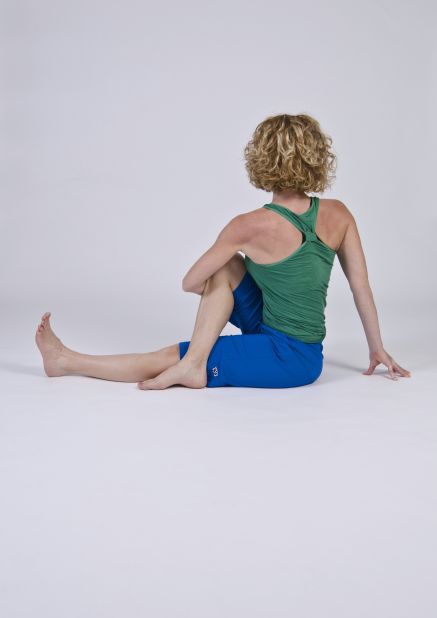This mid-back rotating twist stretches the piriformis. Use caution because incorrect twisting from your low back could exacerbate disc issues.