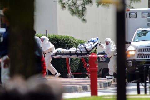 Aid worker Nancy Writebol, wearing a protective suit, gets wheeled on a gurney into Emory University Hospital in Atlanta on August 5, 2014. A medical plane flew Writebol from Liberia to the United States after she and her colleague Dr. Kent Brantly were infected with the Ebola virus in the West African country. 