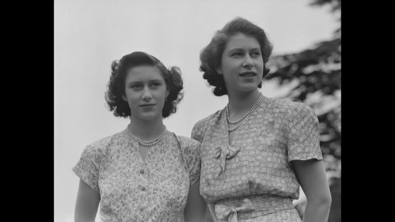 Princess Elizabeth, right, and Princess Margaret wear summer dresses circa 1942.