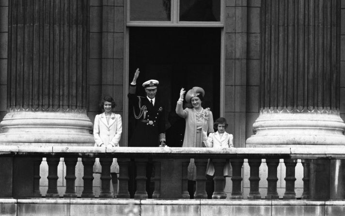 From left, Princess Elizabeth, King George VI, Queen Elizabeth and Princess Margaret wave to the crowd from the Royal Balcony of Buckingham Palace on June 22, 1939. 