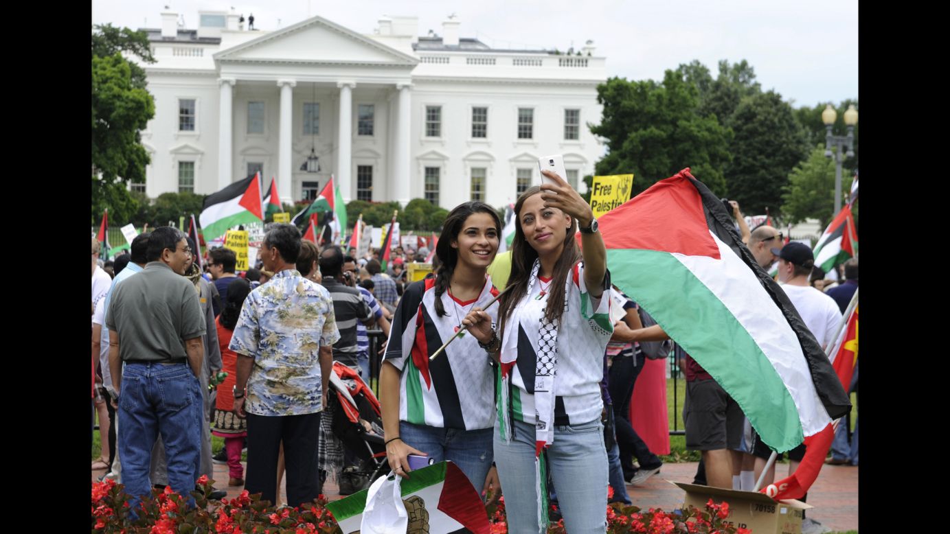 Abby Salem, left, and her cousin Samira Salem pose for a selfie outside the White House during a rally against the violence in Gaza on Saturday, August 2, in Washington.