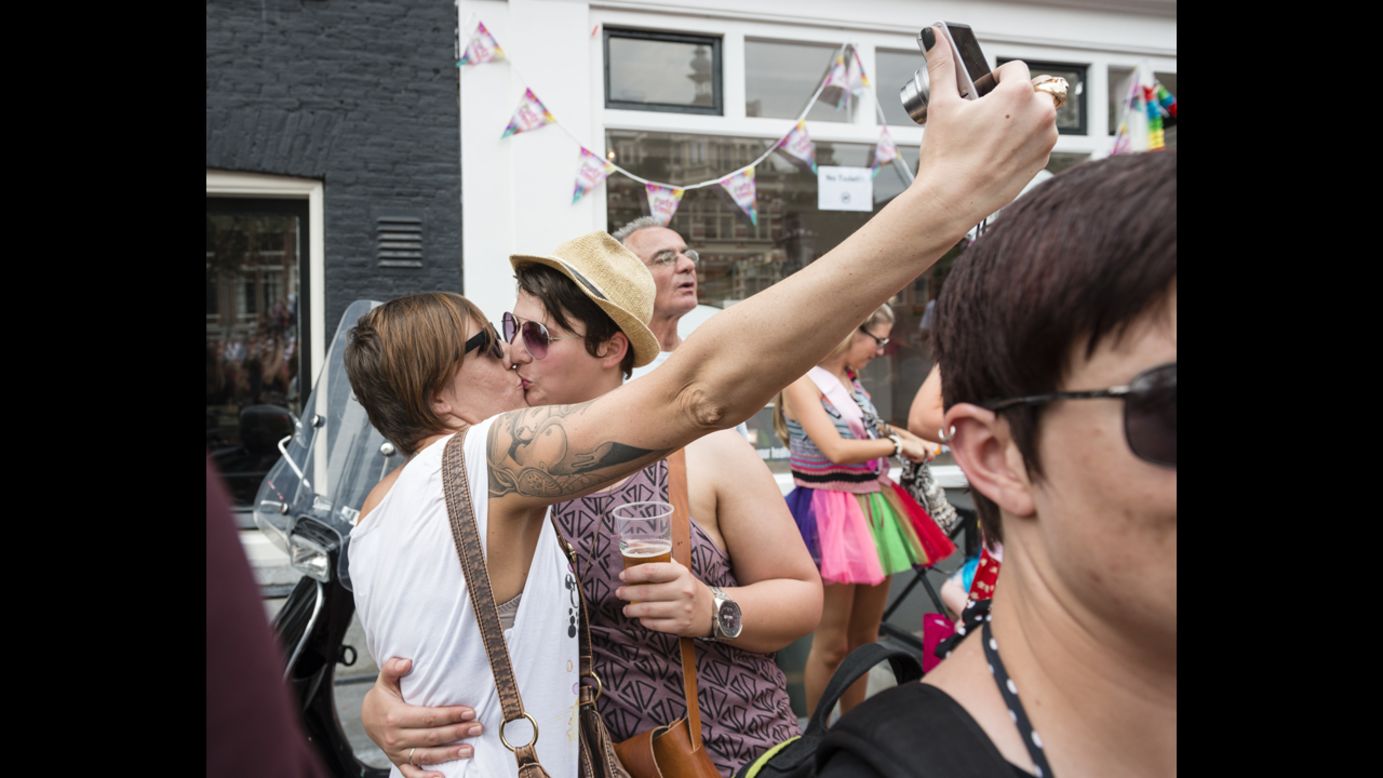Two lesbians kiss while taking a selfie Saturday, August 2, during a gay pride parade in Amsterdam, Netherlands. <a href="http://www.cnn.com/2014/07/30/world/gallery/look-at-me-0730/index.html">See 16 selfies from last week</a>