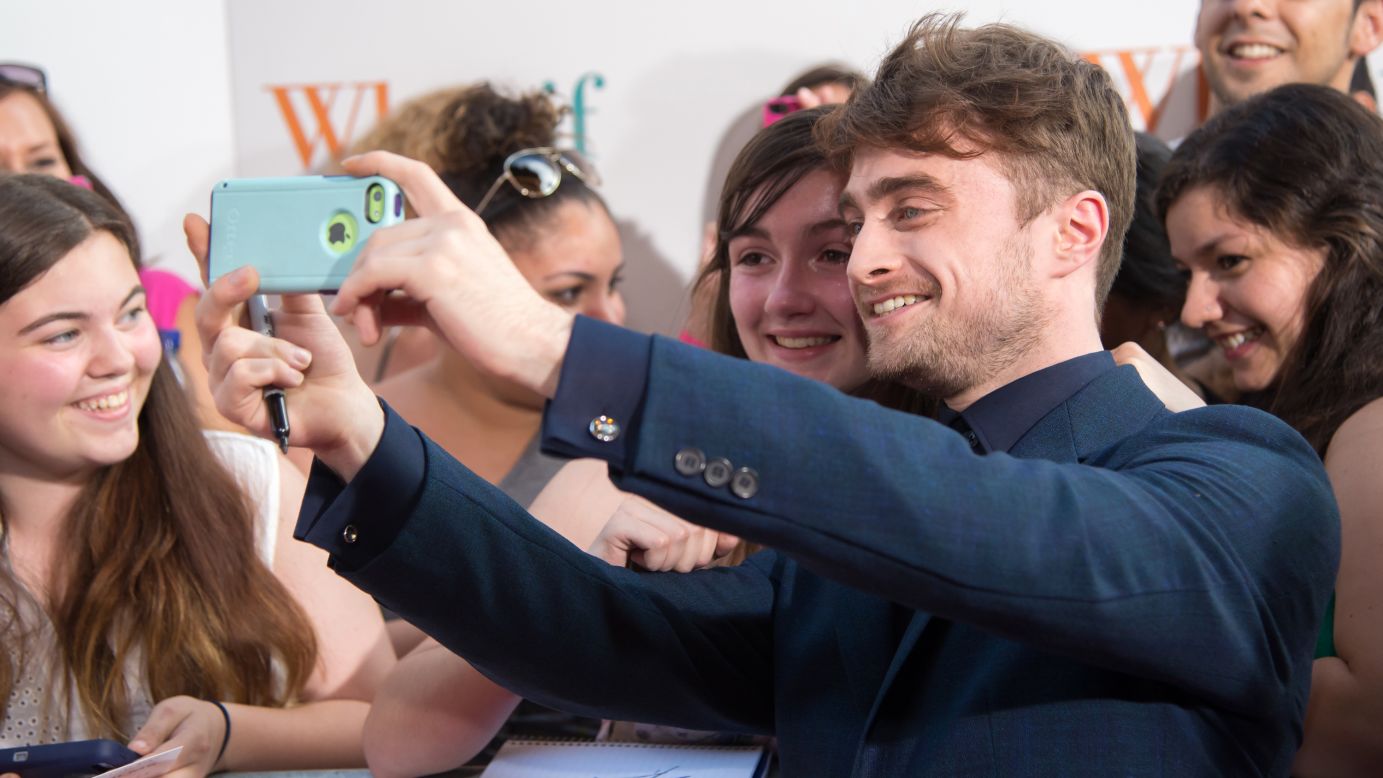 Actor Daniel Radcliffe takes a selfie with a fan at the New York premiere of the film "What If" on Monday, August 4.