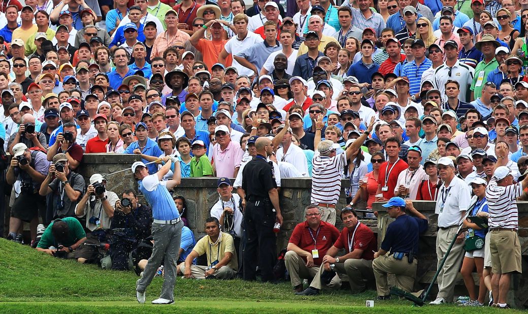 Here we see McIlroy teeing off from the 10th hole during the final round of the 2011 U.S. Open at the Congressional Country Club in Bethesda, Maryland.<br /><br />A short time later, the 21-year-old Northern Irishman would stand on the 18th green and triumphantly lift his first major title.<br /><br />The win was all the more meaningful to McIlroy as it followed on from his final-day collapse at the Masters just a couple of months earlier.<br /><br />"He hit this shot literally inches from the hole," Cannon said. "I love the way the whole crowd is following his ball, apart from the poor policeman and marshals doing their duties, that is."