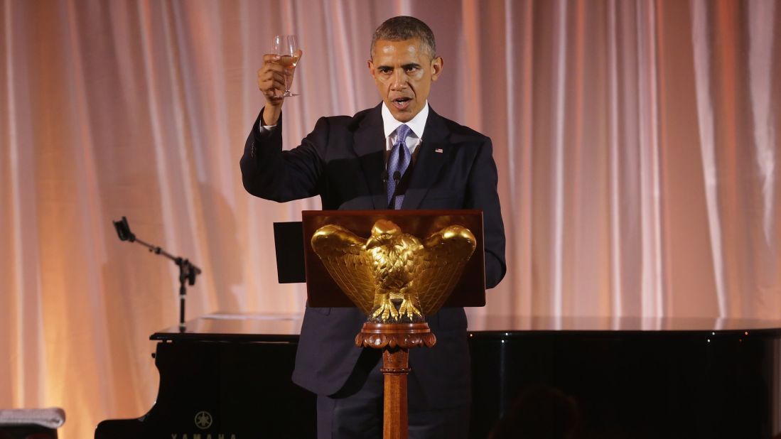 President Barack Obama raises a glass and toasts his guests during a dinner of the U.S.-Africa Leaders Summit on the South Lawn of the White House on Tuesday, August 5, in Washington. Obama is promoting business relationships between the United States and African countries during the three-day summit, where heads of state are meeting. 