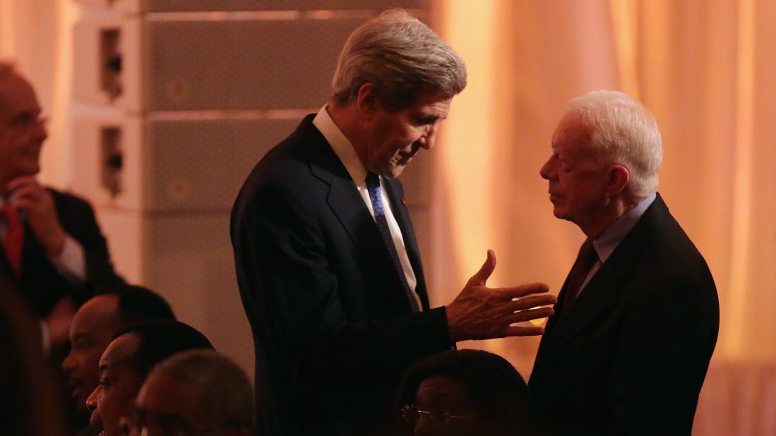 Secretary of State John Kerry, left, talks with former President Jimmy Carter. 