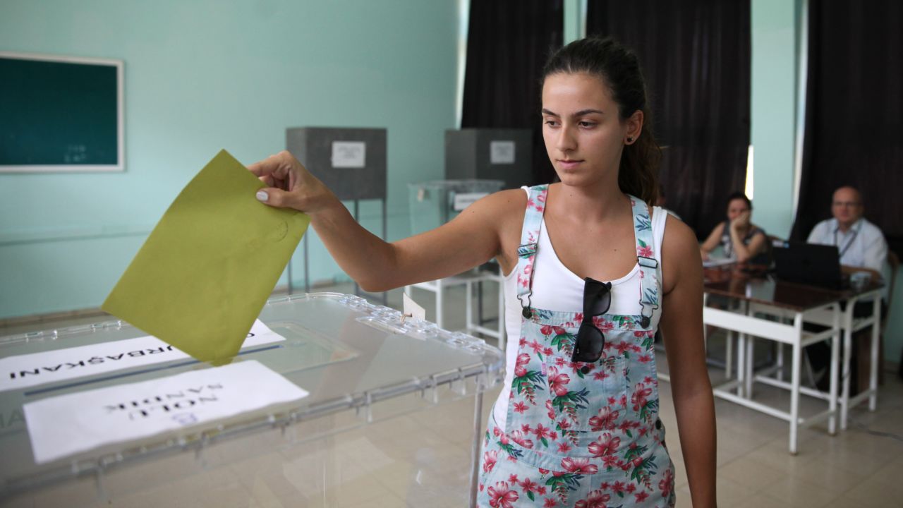 A Turkish national in Nicosia, Cyprus, casts her vote Friday, August 1. Turkish citizens in other countries have been able to cast their votes early.