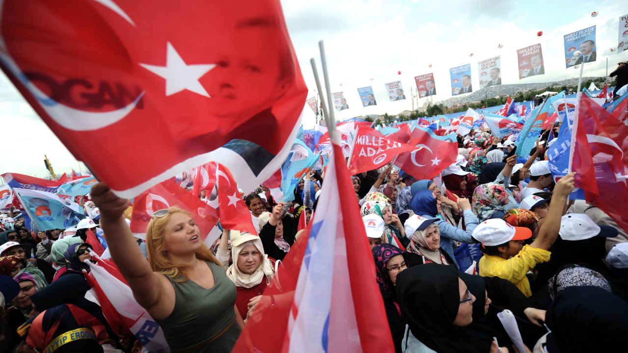 Supporters of Recep Tayyip Erdogan wave Turkish flags during a rally on August 3, 2014 in Istanbul.