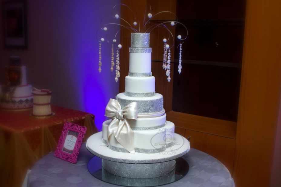 <strong>Dainty Affairs Bakery</strong><br /><br />No wedding is complete without a multi-tiered cake, and in Nigeria the size and elaborate details of the sweet treat have a particularly competitive aspect. <br /><br />"Wedding cakes are a huge part of our business," says Lolade Ogunjimi, owner of the Dainty Affairs bakery which supplies fairy-tale cakes to some of the most high profile weddings in the country. "A Nigerian bride is really aware of what's happening around her, so she always wants a bigger cake. That's why I call it the bread and butter of the bakery," she adds. <br /><br />Ogunjimi is currently working on her most extravagant commission yet -- a 12-tier creation which will sit on a custom-made table, all for a lavish, Cinderella-themed wedding. <br />