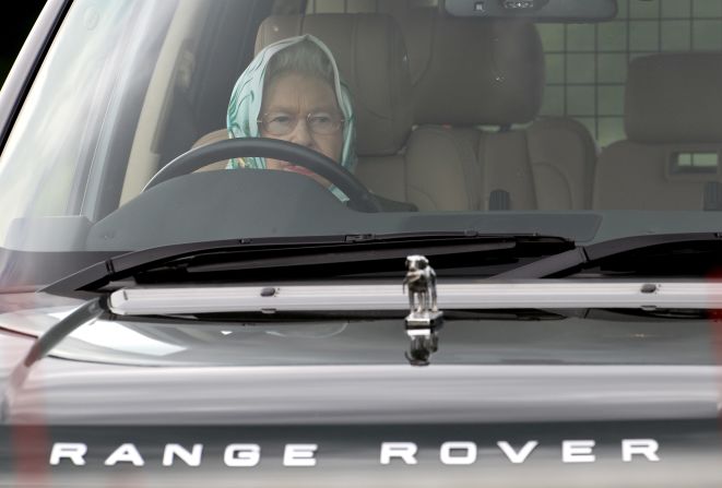 Queen Elizabeth II drives her Range Rover as she attends the Windsor Horse Show in May 2011.
